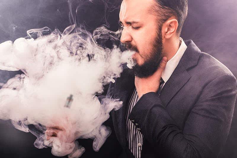 guy coughing after vaping