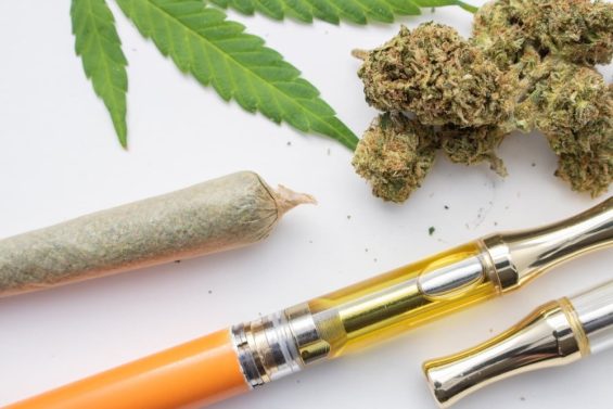 marijauna and cannabis vape pen on a white surface