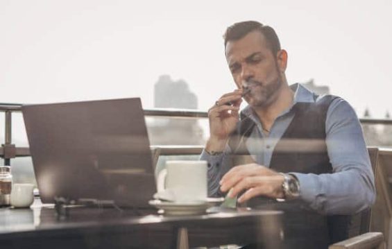 man vaping at work