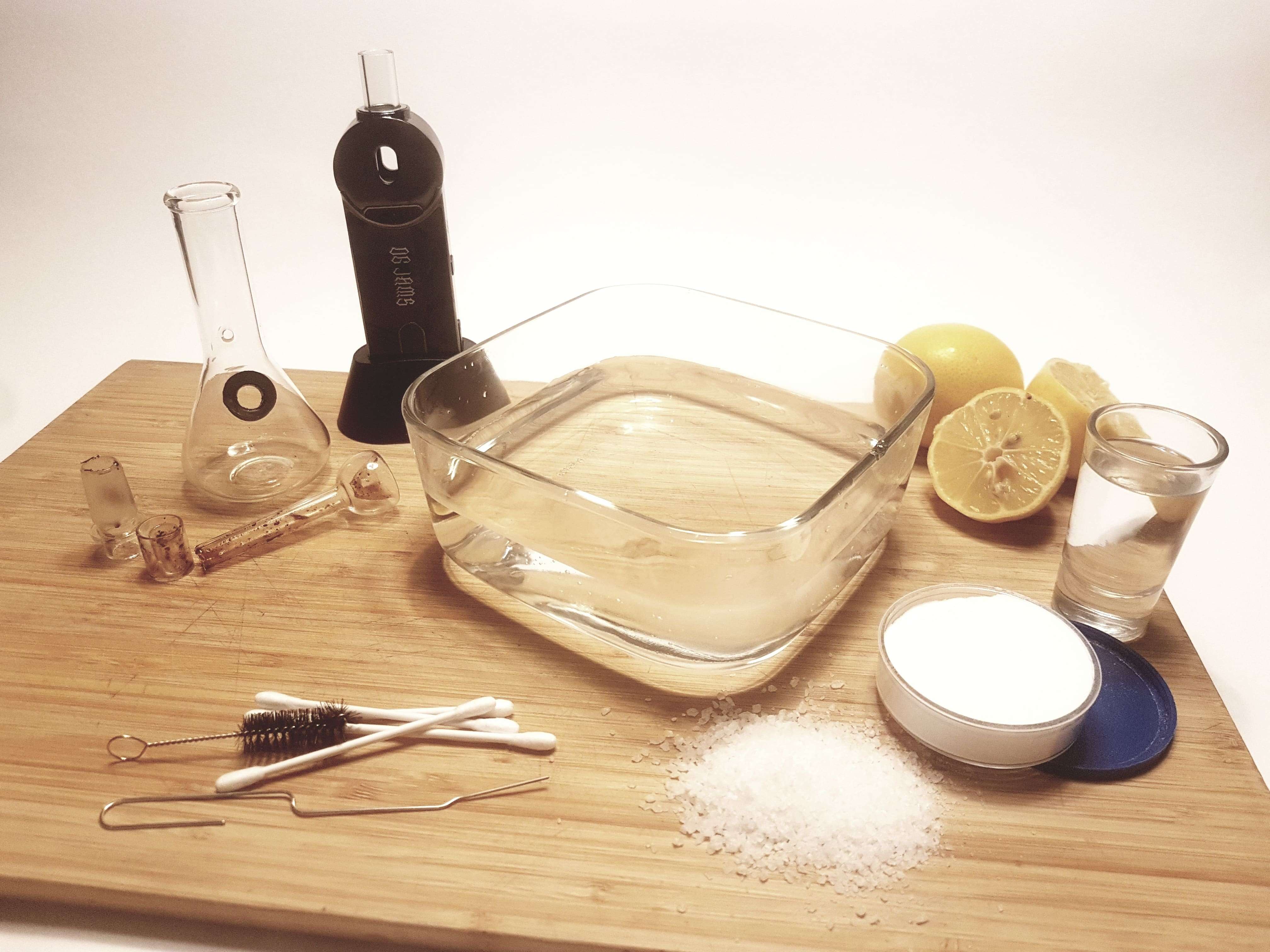 glass bubbler and ccleaning tools on a white background
