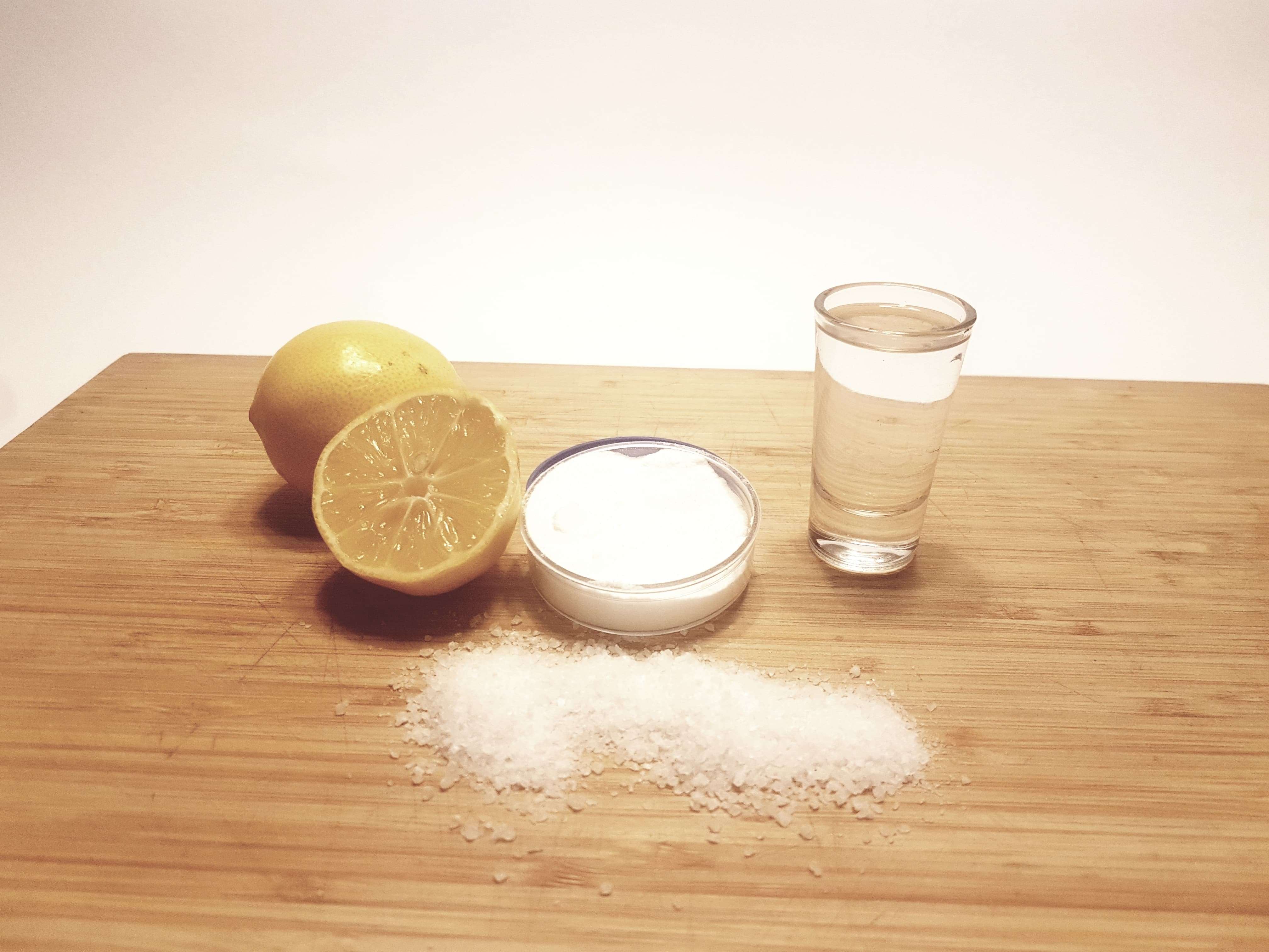 image of alternative cleaning solutions for cakey bongs and bubblers - lemon, salt, white vinegar, and baking soda.