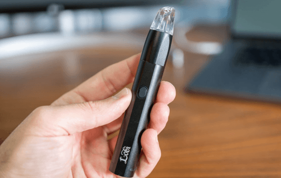 Image of a person holding a Lobi vaporizer pen for dabs.