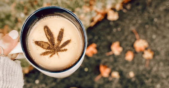 cup of coffee with a cannabis leaf stencil